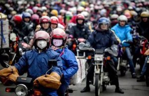 Migrant Workers Travelling Home by Motorcycle Receive Free Gifts